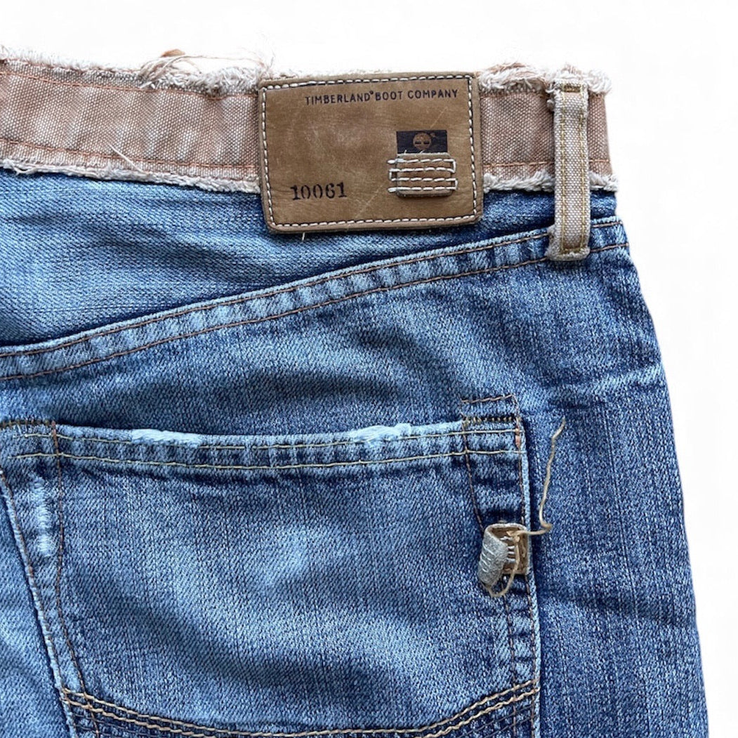 Jean Timberland vintage bleu droit avec effet usé et ceinture effilée