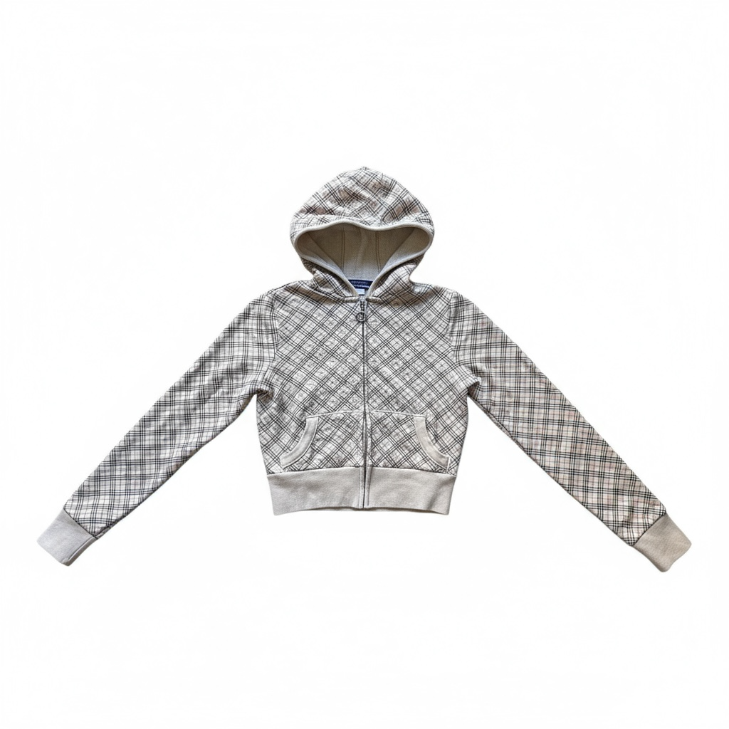 Sweat à capuche court zippé à motif tartan beige et gris, avec poches kangourou et finitions côtelées.