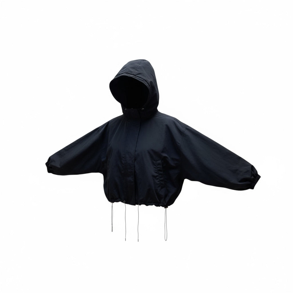 Veste coupe-vent noire Sheena avec capuche, boutons-pression et cordon de serrage, taille M/L