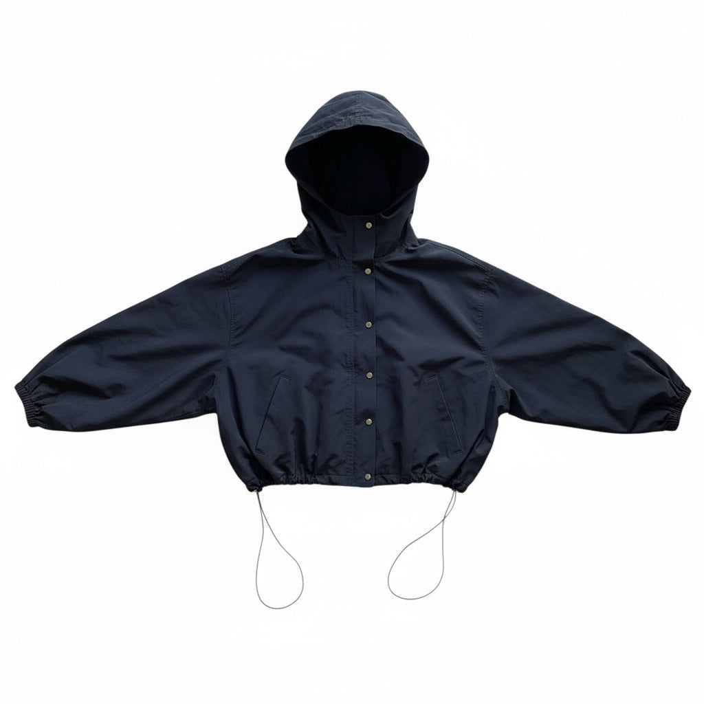 Veste coupe-vent noire Sheena avec capuche, boutons-pression et cordon de serrage, taille M/L